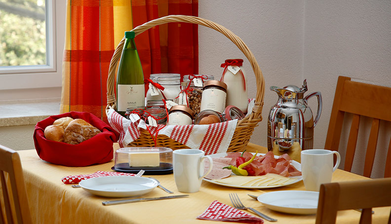 Breakfast basket with products from the farm and the region